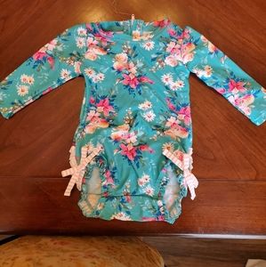 6-12m NWT RuffleButts Fancy Me Floral Rashguard